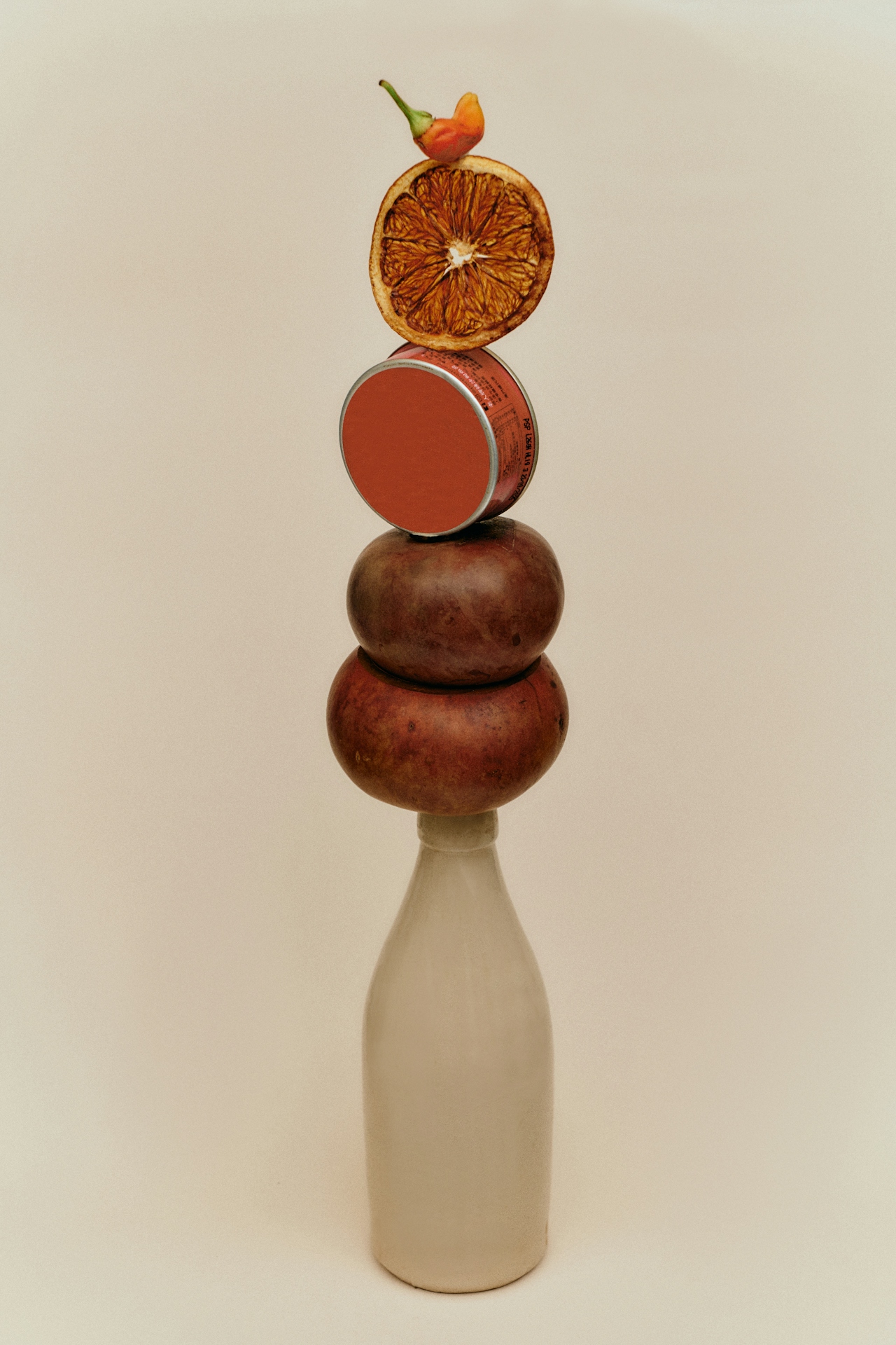 fruit balancing on top of bottle