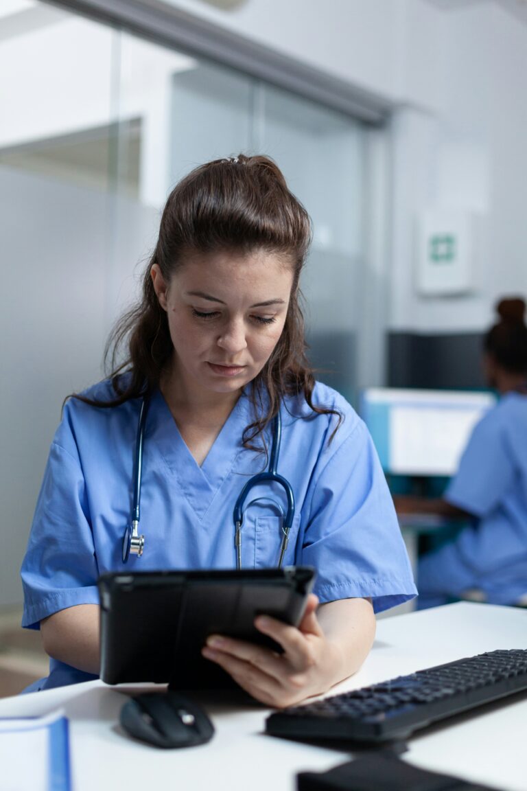 medical professional looking at tablet