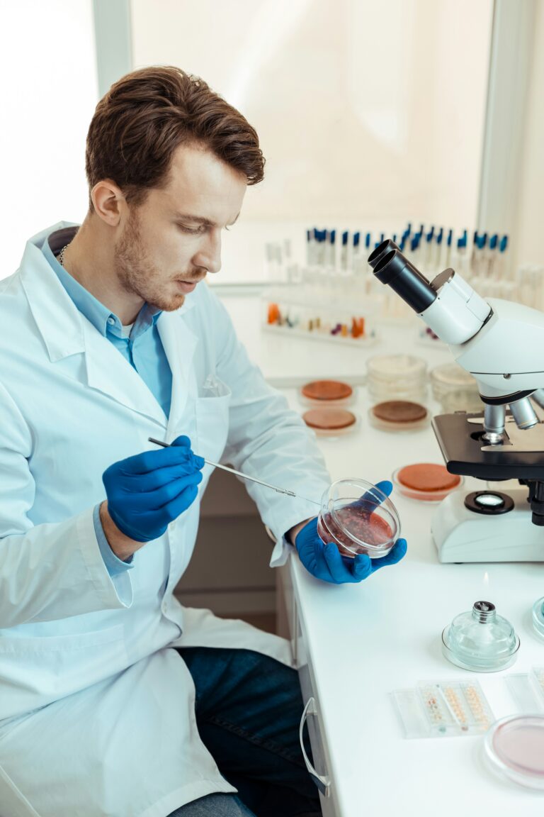 researcher looking at slides