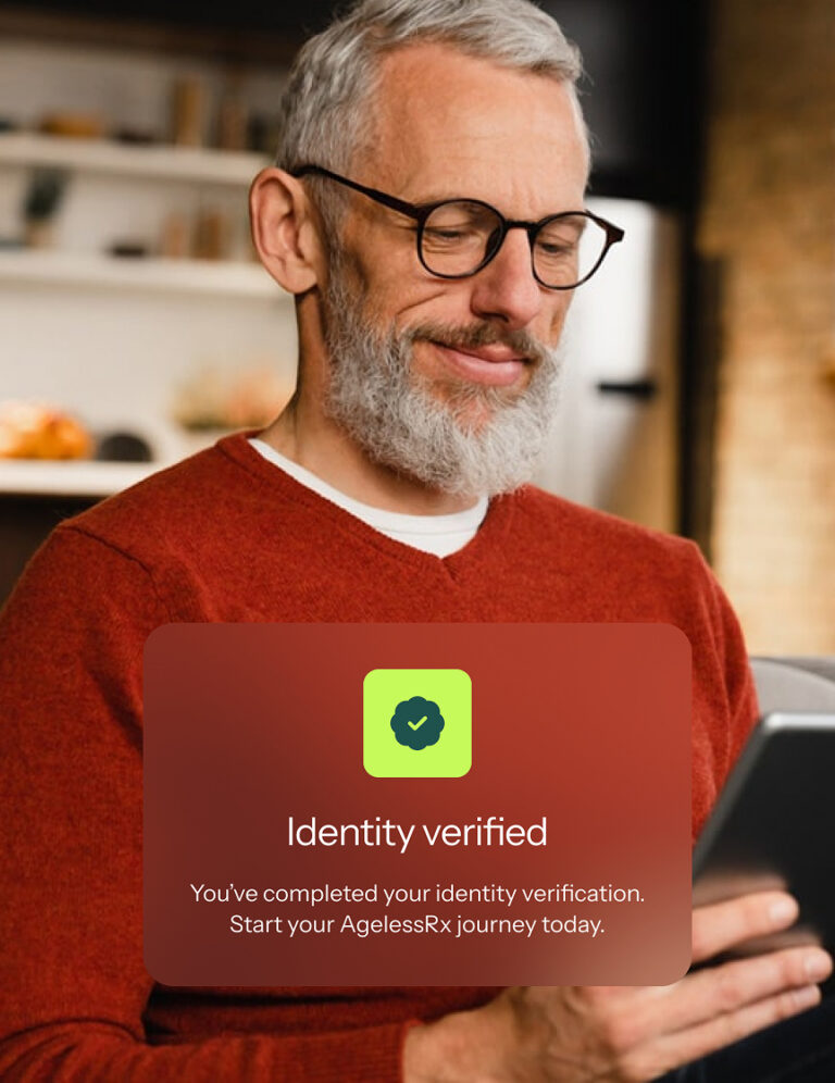Man using a tablet at home with an overlay confirming his identity has been verified to begin his AgelessRx journey