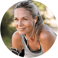 Woman wearing activewear listening to music