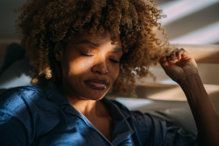 woman relaxing with a sunlight on her face