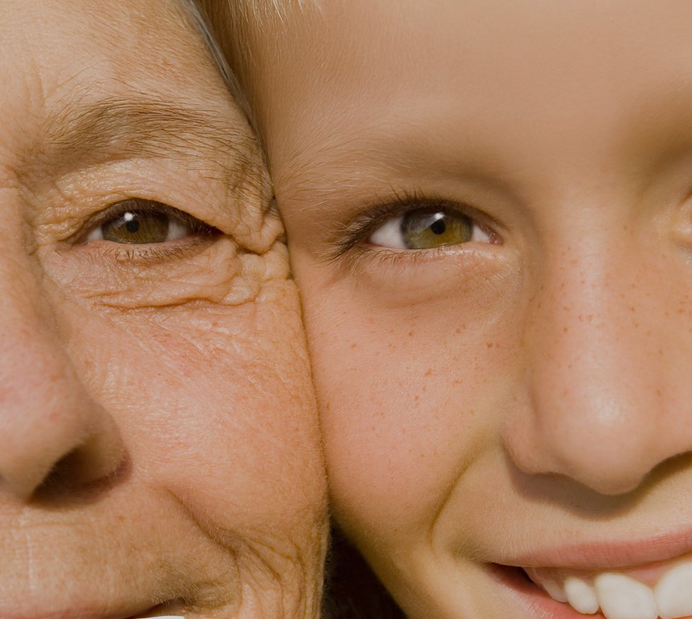 old woman with young girl side by side faces
