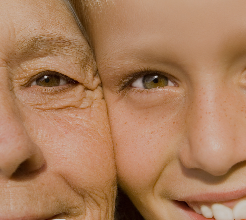 old woman with young girl side by side faces